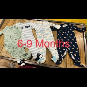 4 piece sleeper bundle. Baby boy size 6-9 months mostly carters